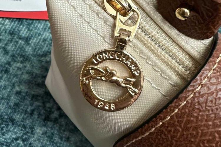 Túi Longchamp Le Pliage Xtra XS Pouch Ecru Canvas Cognac Leather Kem
